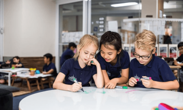 Pictured are three students studying